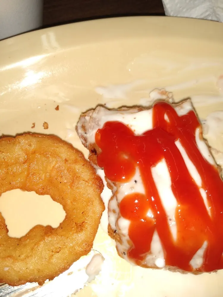 Country Fried Steak with Gravy and Ketchup Also an Onion Ring
