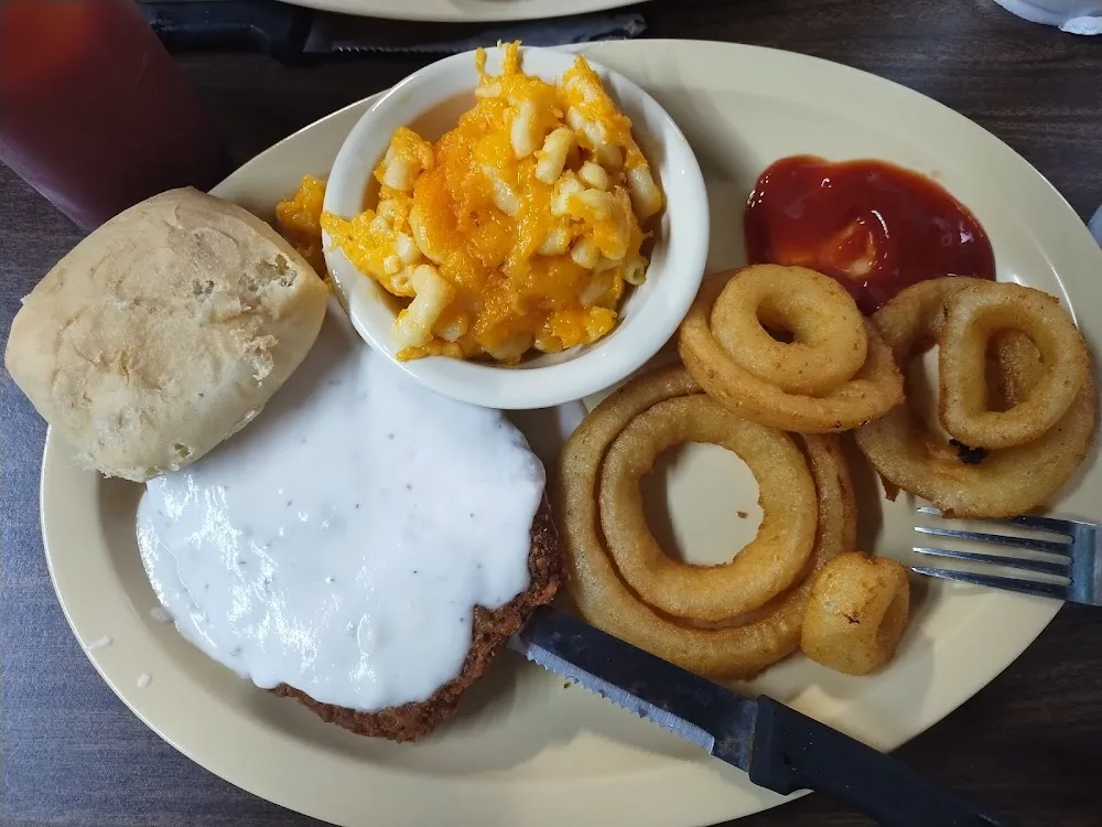 Country Fried Steak with White Gravy Mac and Cheese Onion Rings and a Roll